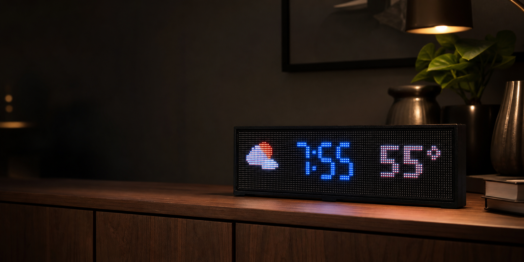 Pixora 128 by 32 LED display resting on a wooden console in a modern home